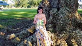 Becca holding a promo copy of 7" Kara Volume 2.